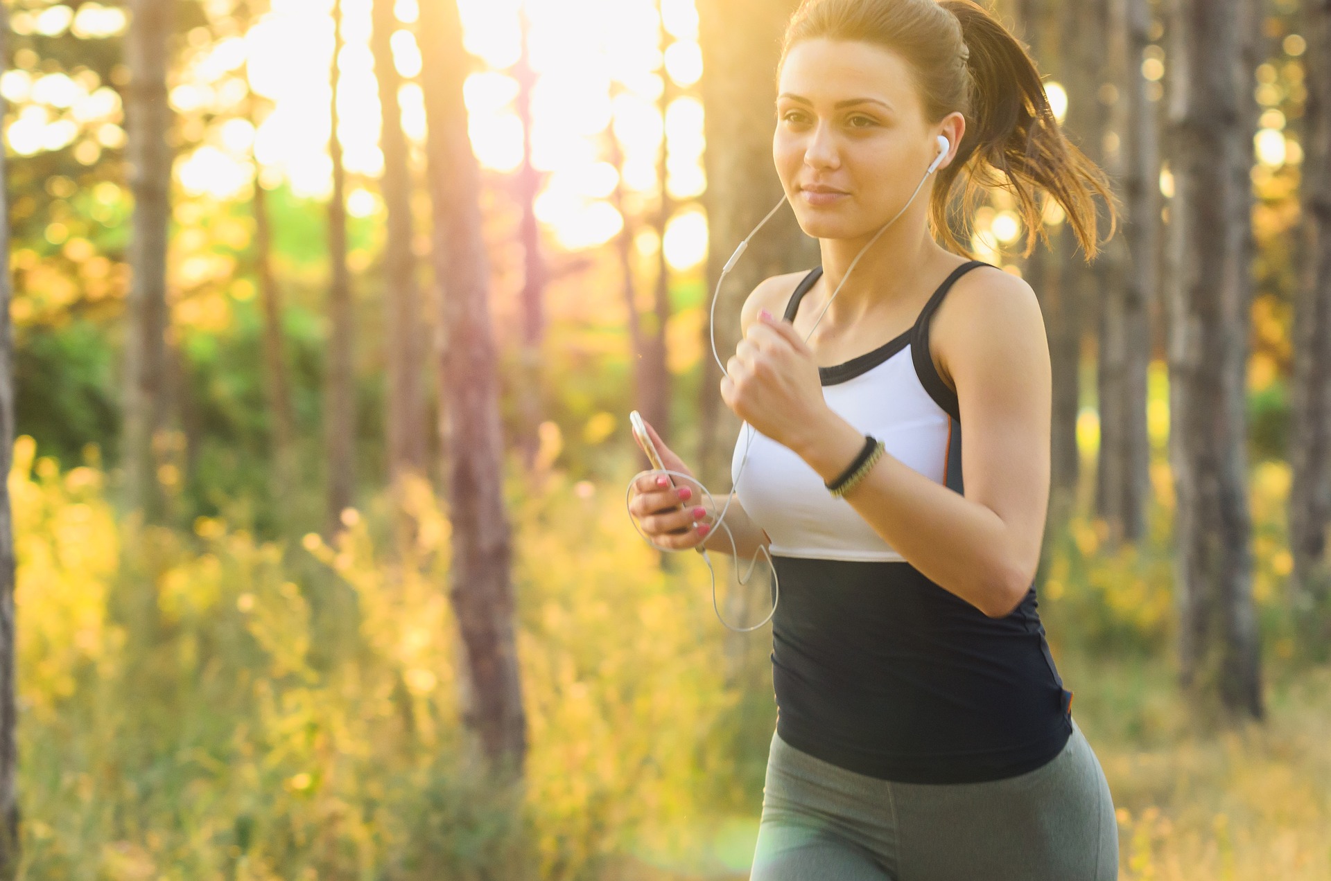 Woman walking outdoors for daily step goal and fitness