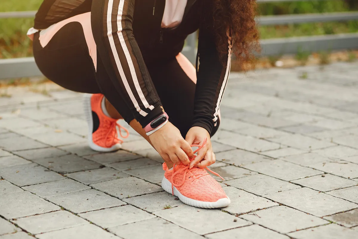 Person walking outdoors to increase their daily step count