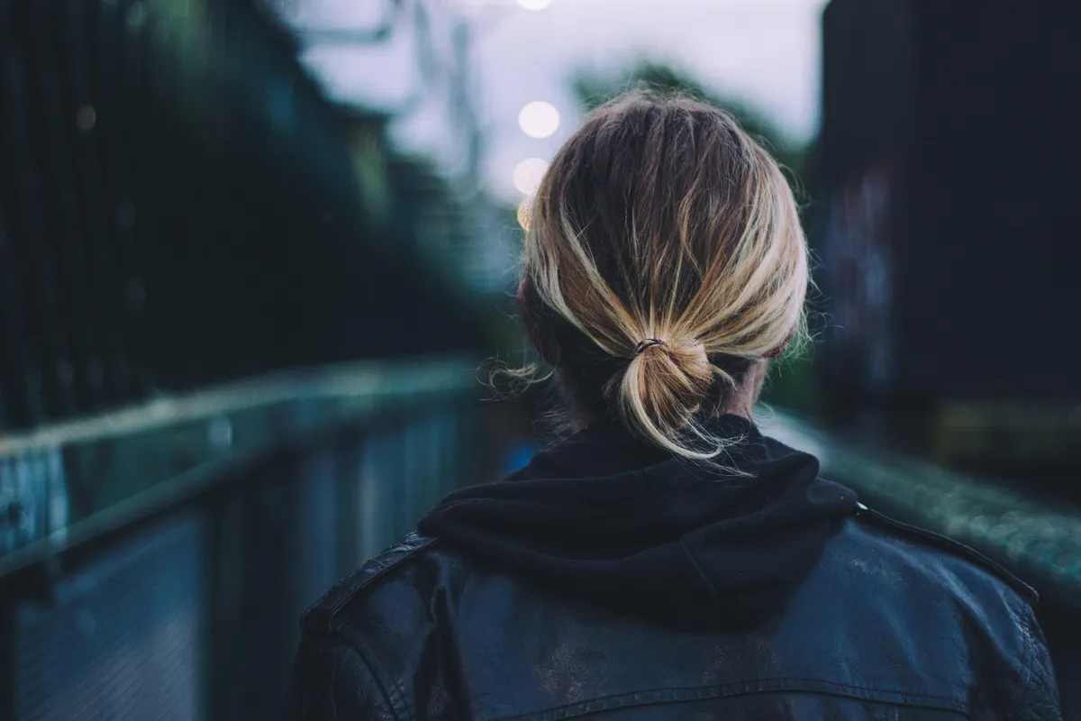 Person walking outdoors building a daily walking habit without hating exercise