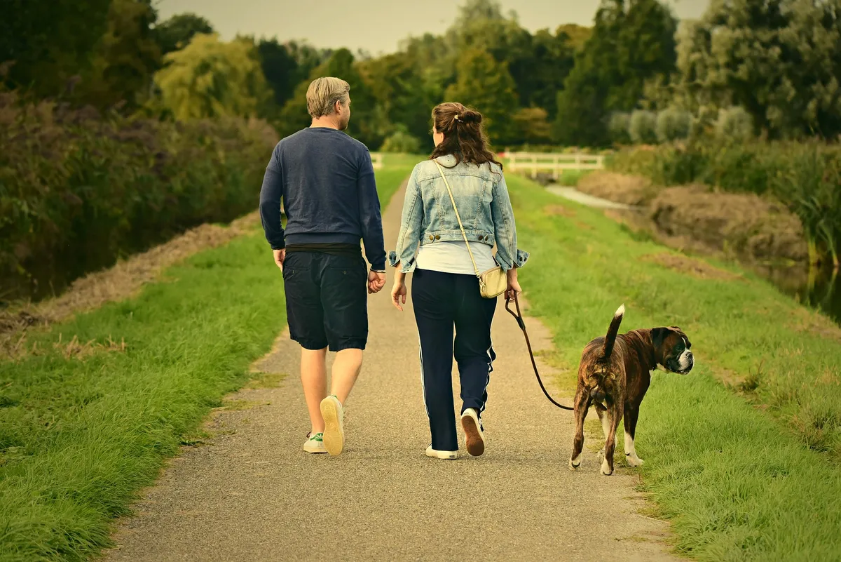 Person walking outdoors with daily step goal motivation